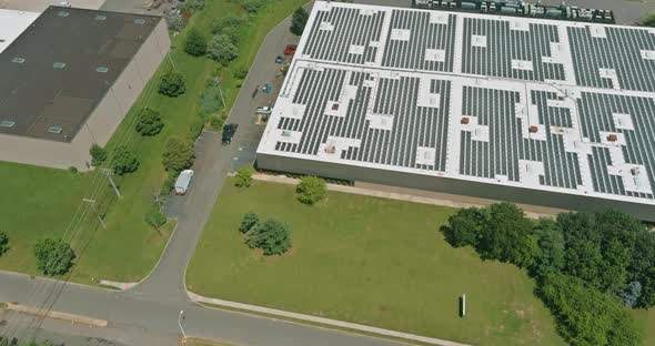 Solar Panels Installed on a Roof of a Industrial Building a Warehouse alt