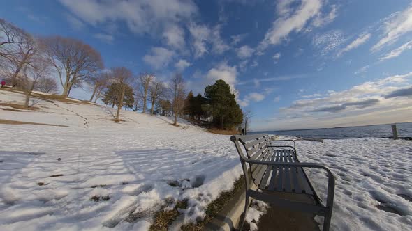 Winter motion timelapse during sunset near waterfront alt