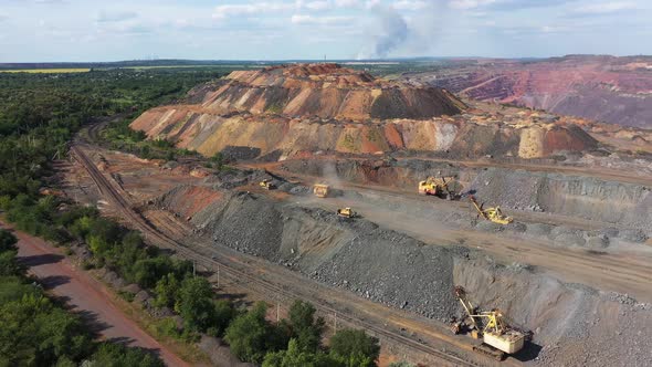 Open Quarry with Heavy Duty Machinery alt