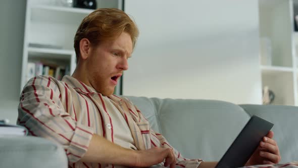 Man Working Laptop Yawning at Home Office Closeup alt