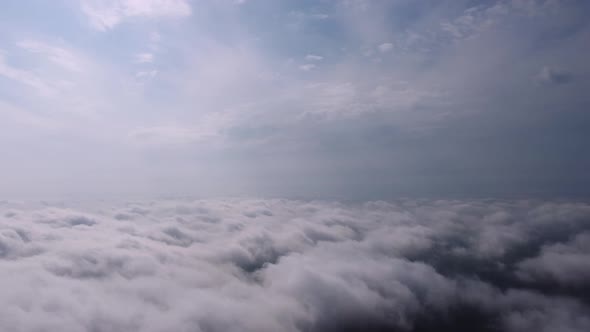 Aerial Perspective View of Flying Over Clouds alt