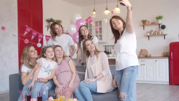 Women Taking Group Photo at Baby Shower Party