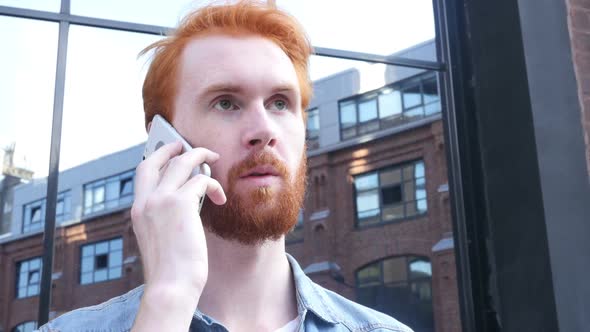 Negotiation on Phone by Young Man, Outdoor alt