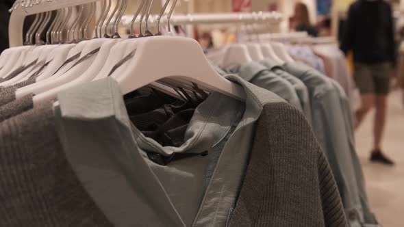 Clothing Store. Women's Clothing Hangs on Hangers Inside the Store. alt