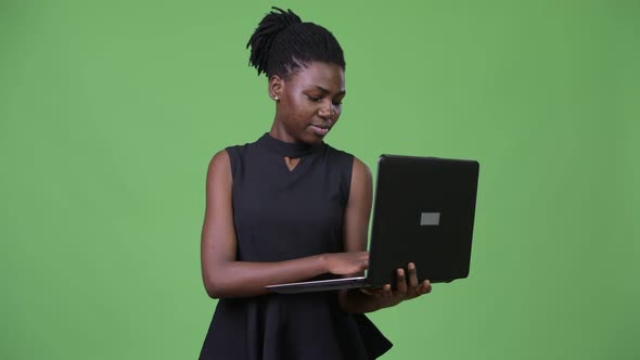 Young Beautiful African Businesswoman Using Laptop