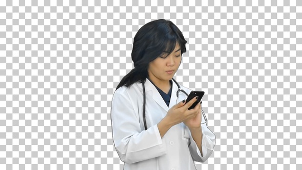Pensive asian woman doctor using smart phone, Alpha Channel