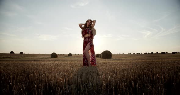 Young Girl In A Field In A Straw Hat alt