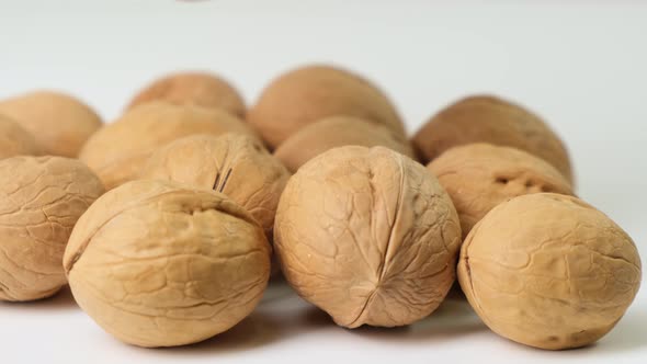 Fresh walnuts on white background. Close up.
