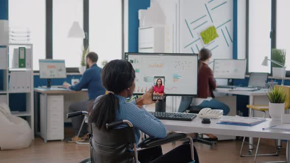 African Employee with Disabilities Paralyzed Invalid Explaining Financial Reports alt