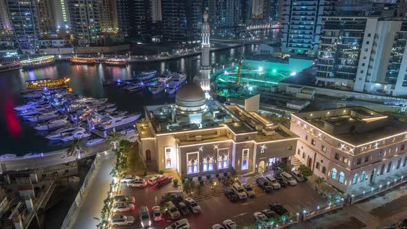 Yachts in Dubai Marina Flanked By the Al Rahim Mosque and Residential Towers and Skyscrapers Aerial alt