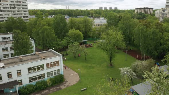 Children Play on the Playground in Kindergarten in Summer Aerial View