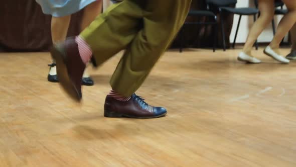 Dancing legs close up. Dancers perform lindy hop dance.