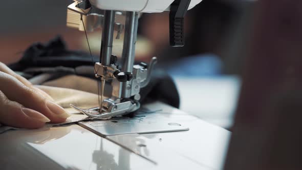 Female Hands Work on Sewing Machine
