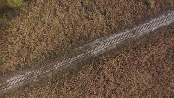 Top view of old railway track in the field 4K drone footage