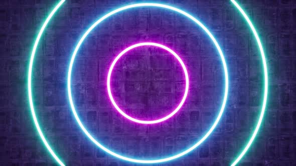 Glow Neon Circle Light Frame On Rotating Cement Wall alt