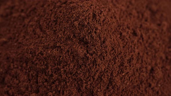 pouring ground coffee top view, rotation. 4K UHD video alt