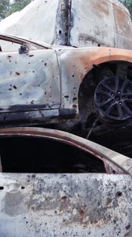 Vertical Video of a Dump of Destroyed Cars During the War in Ukraine alt