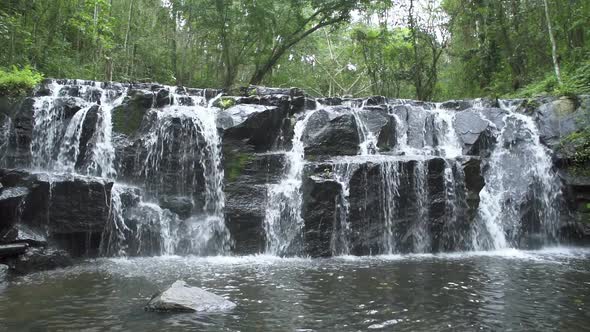 Beautiful stream and waterfall in tropical forest at Namtok Samlan National Park - Slow Motion