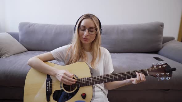Woman Plays the Guitar at Her Home Happily Having Fun Playing Guitar and Singing alt
