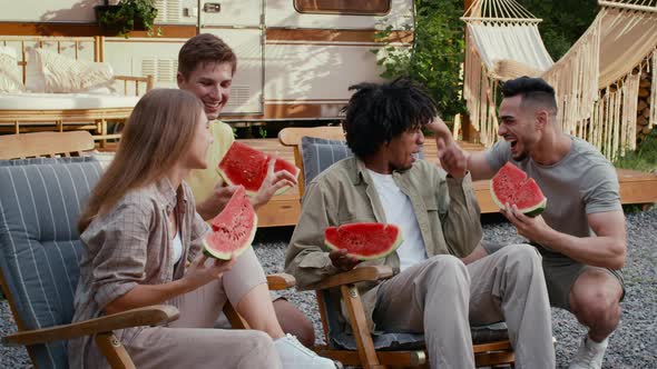 Group Of Happy Multiethnic Friends Eating Watermelon At Outdoor Party In Camping alt