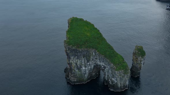 Drone Arcing Over Drangarnir Sea Stacks In Faroe Islands alt