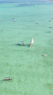 Vertical Video Boats in the Ocean Near the Coast of Zanzibar Tanzania alt