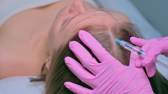Doctor Making Injections Mesotherapy in Woman Skin Head for Hair Growth