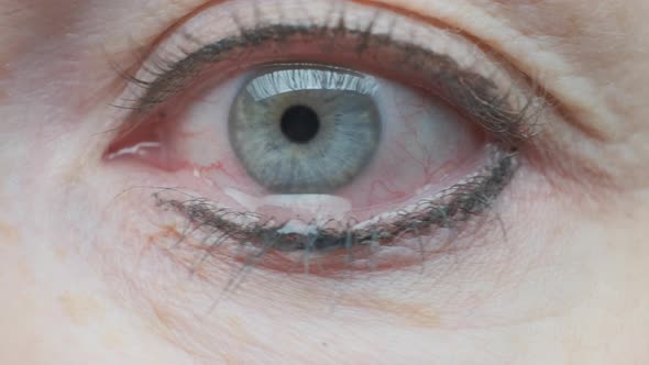 drop of tears flowing down cheek from eye crying woman  alt