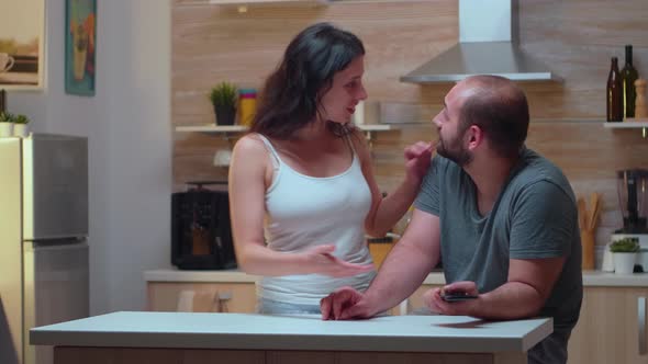 Jealous Woman Checking Man's Phone alt