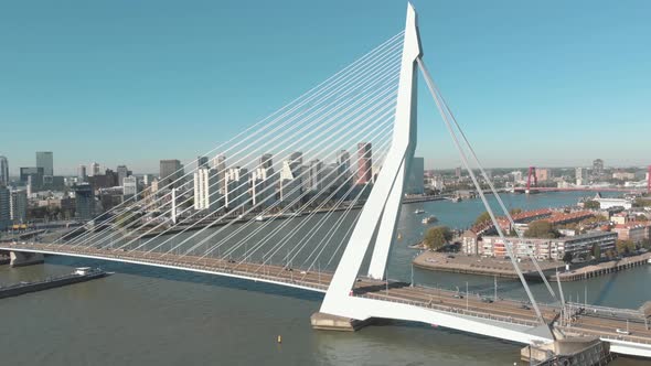 Drone footage of the Erasmus Bridge, The Swan, crossing over the few water channels of Rotterdam alt