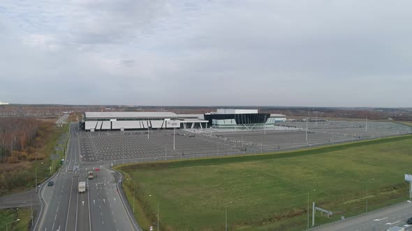 A building for conferences, exhibitions, concerts with and highway with cars 07 alt