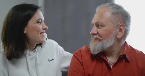 Young Daughter Embracing Her Father with Love alt