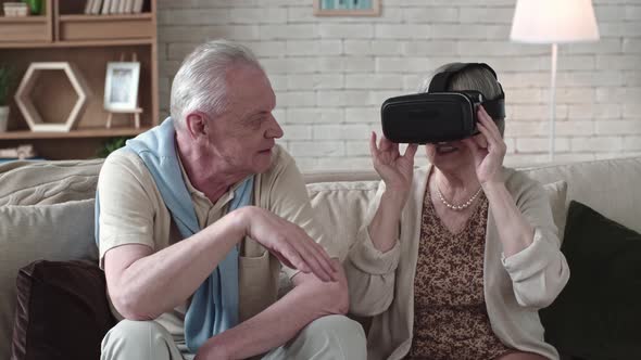 Laughing Elderly Woman in VR Headset alt