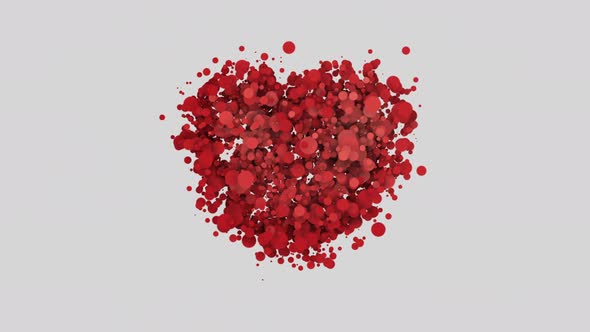 red particles shaped heart on a gray background, copy space alt