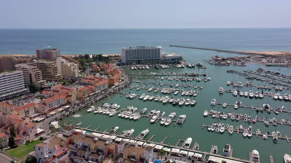 Aerial Video of the Tourist Portuguese Town of Vilamoura with Views of the Beaches and Docks for alt