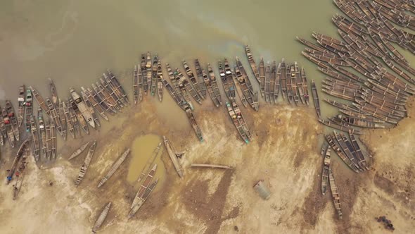 Aerial view of many Canoe docked along Rakti river, Bangladesh. alt