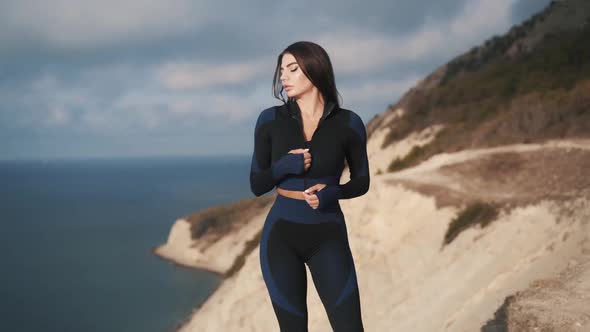 Slow Motion Beautiful Sexy Caucasian Woman is Unbuttoning Her Jacket alt