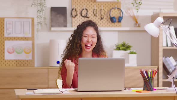 Long Curly hair woman talking to camera looking at webcam indoors at home office and cheerful from g alt
