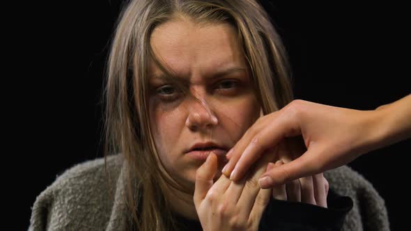 Social Worker Revealing Bruised Woman Face, Help for Domestic Violence Victims alt