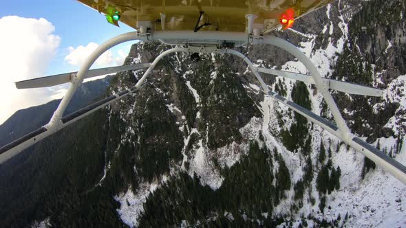 Cascade Mountain Helicopter View Flying Over Snowy Jagged Forest Ridge alt