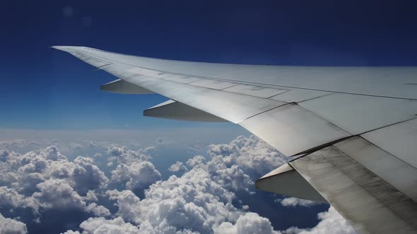Wing of the Plane and Clouds View From the Plane alt