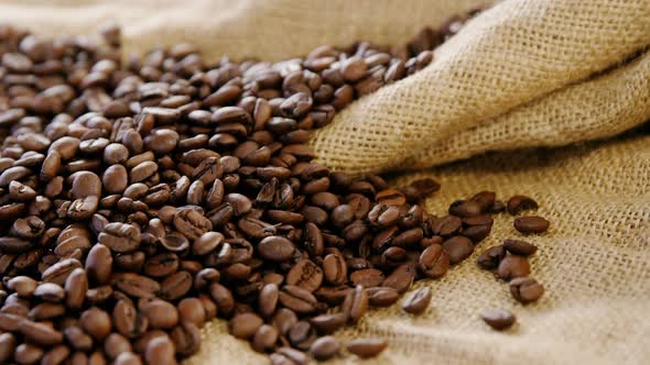 Roasted coffee beans on sack textile alt