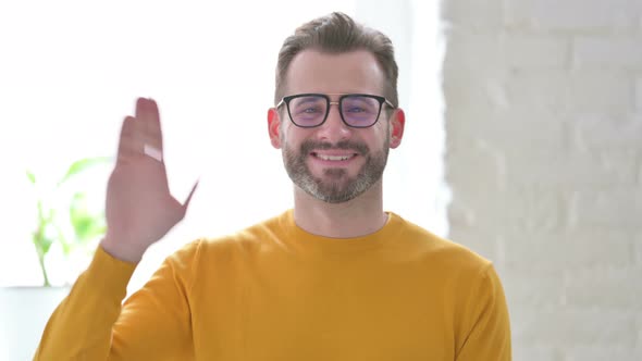 Portrait of Man Waving Welcoming alt
