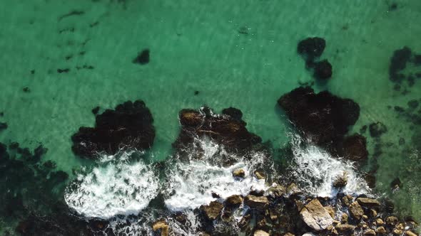 Aerial Panoramic View of Seascape with Crystal Clear Azure Sea and Rocky Shores alt
