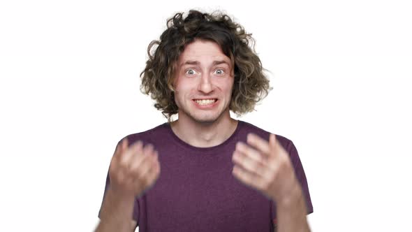 Portrait of Angry Tense Man 20s Grabbing His Head and Screaming While Gesturing in Annoyance Over alt