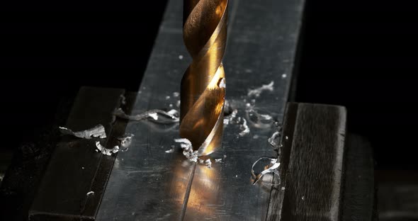 952071 Metal Drill Turning on a Steel Plate Making Chips, Reel Time 4K alt
