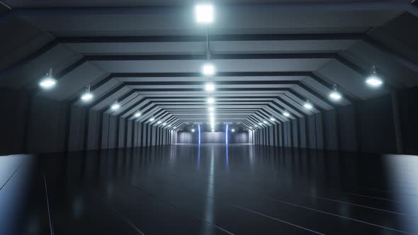 A large Empty Warehouse With Reflective Lights And Floor alt