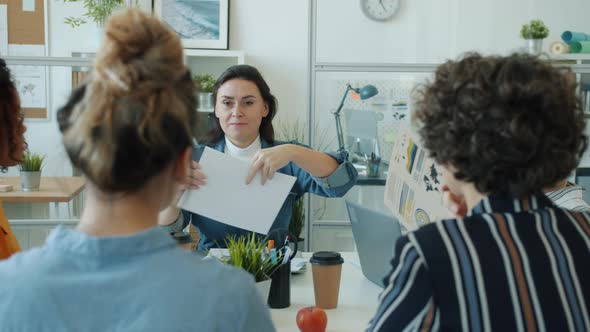 Successful Women Young and Mature Talking Then Clapping Hands Working in Office Together alt
