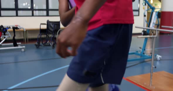 Man exercising with prosthetic legs alt