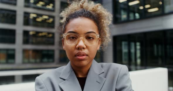 AfricanAmerican Businesswoman Looks at the Camera alt